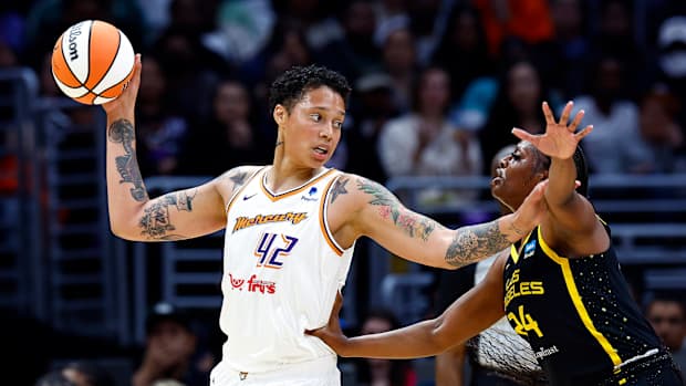 Brittney Griner controls the ball against Joyner Holmes